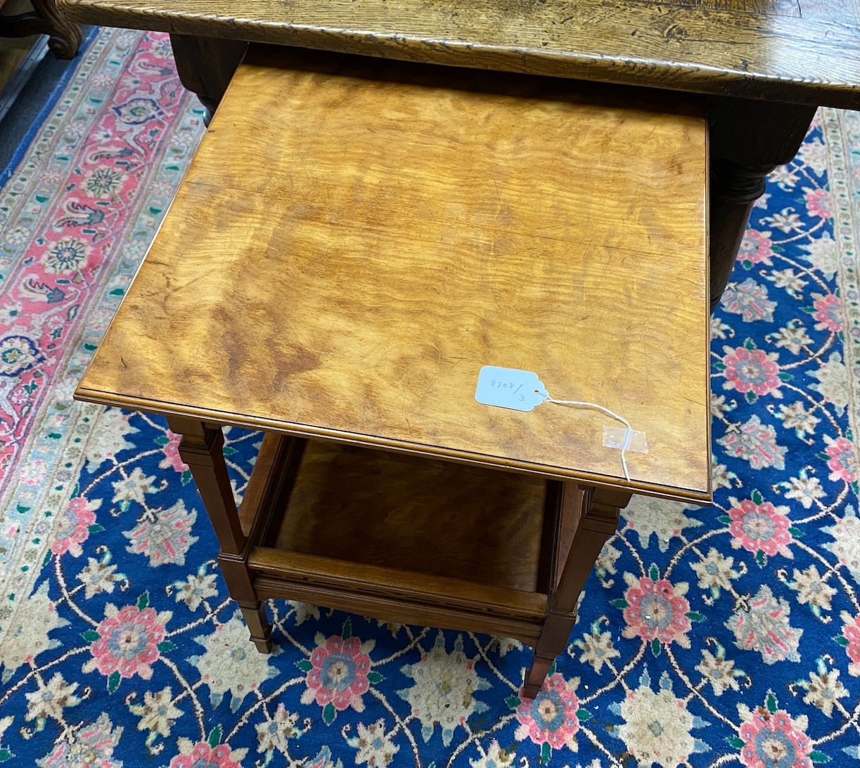 An Edwardian square satinwood two tier occasional table, width 48cm, height 68cm